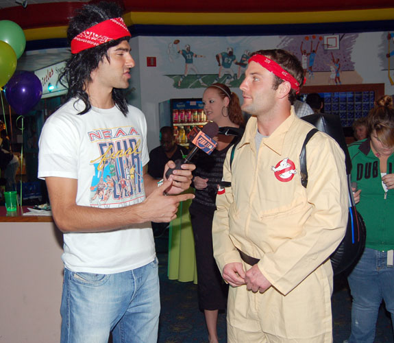 WTVJ/NBC6 weekend sports reporter/anchor Adam Kuperstein, left, interviews Miami Dolphins wide receiver Wes Welker at Randy McMichael's charity bowling event.