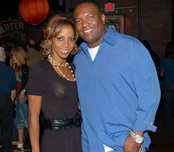 Holly Robinson and Rodney Peete pose for ABM's cameras at Alonzo Mourning's charity bowling event at Lucky Strike on South Beach.