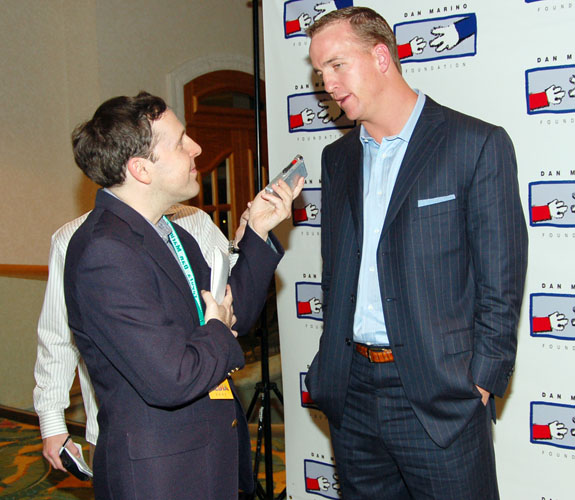 Miami Herald reporter Barry Jackson interviews Peyton Manning at the Marino Foundation Charity Dinner at the Loews Hotel on Miami Beach, Fla.