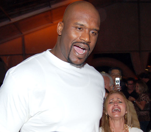 Miami Heat center Shaquille O'Neal reacts as he is accosted by fans at the annual South Beach Wine & Food Festival Bubble Q on the sand behind the Delano Hotel.