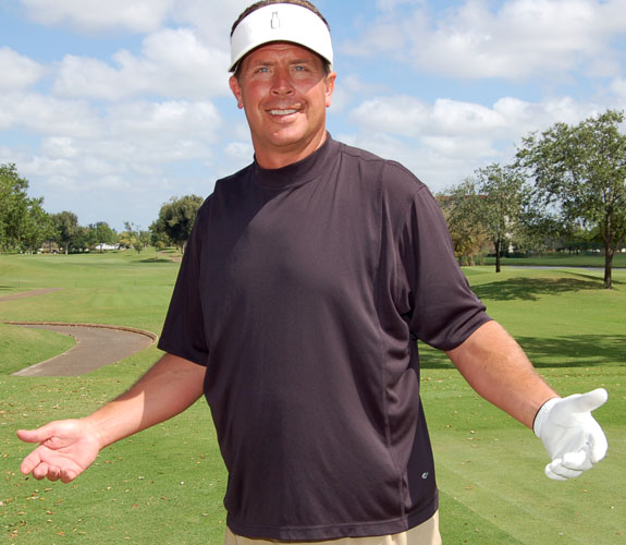 Ex-Miami Dolphins quarterback Dan Marino reacts after teeing off at Jason Taylor's Celebrity Golf Event at Grande Oaks Country Club in Davie, Fla.