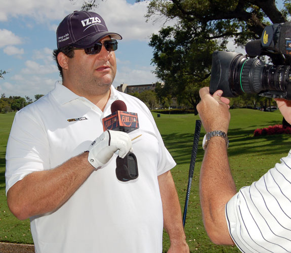FOX Sports sideline reporter and ex-NFL defensive lineman Tony Siragusa clowns with a local camera crew at Jason Taylor's Celebrity Golf Event.
