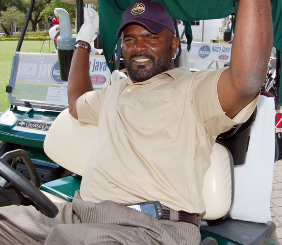 Hall of Fame linebacker Lawrence Taylor kicks back in his cart before the start of Jason Taylor's Celebrity Golf Event at Grande Oaks.