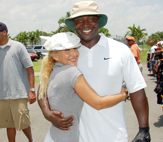 Ex-NFL wide receiver Sterling Sharpe with an adoring fan at DJ Irie's Celebrity Golf Event at the Miami Beach Golf Club on Alton Road.