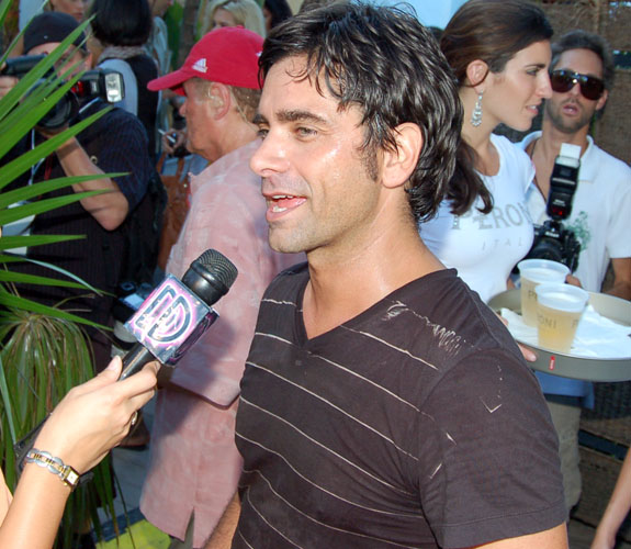 Actor and musician John Stamos talks with the local media after jamming with the Beach Boys during Mercedes-Benz Fashion Week at the Raleigh Hotel.