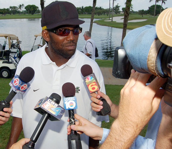 New England Patriots wide receiver Randy Moss talks with a throng of reporters during the ZSG Celebrity Golf Event at the Blue Monster in Doral, Fla.