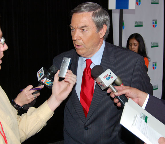 Former California Congressman Duncan Hunter speaks with reporters at an impromptu media gathering after a GOP debate on campus at the University of Miami.