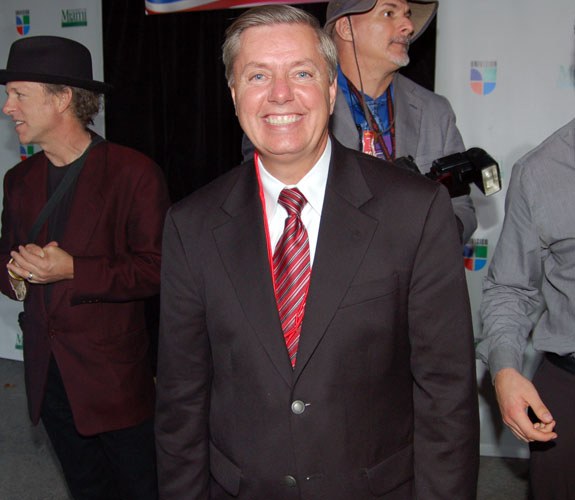 Former South Carolina Congressman Lindsey Graham observes the proceedings at a GOP debate on campus at the University of Miami in Coral Gables, Fla.