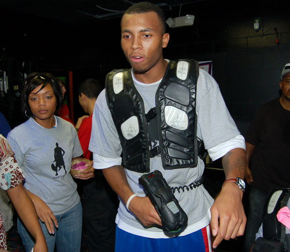 Miami Heat guard Daequan Cook readies for a game of laser tag at teammate Dwyane Wade's annual charity Christmas Party at Boomer's in Dania Beach, Fla.