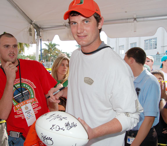 Former University of Miami quarterback Ken Dorsey is beseiged for autographs during the Orange Bowl closing ceremonies in downtown Miami.