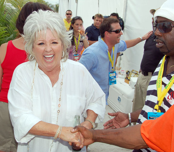 Celebrity chef Paula Deen smiles for fans on the sands of Miami Beach during the South Beach Wine & Food Festival Grand Tasting.