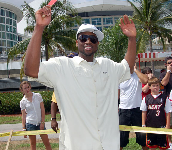 Miami Heat guard Dwyane Wade rejoices after winning a game of table tennis at the team's annual Family Fest celebration.
