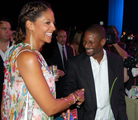 Tracy Mourning shares a laugh with Ian Grocher, a.k.a. DJ Irie, at the Jason Taylor Celebrity Dinner at the Hard Rock Live in Hollywood, Fla.