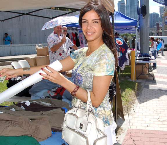 Supporters of Illinois junior senator Barack H. Obama purchase souvenirs outside of Bicentennial Park before a campaign rally in downtown Miami.