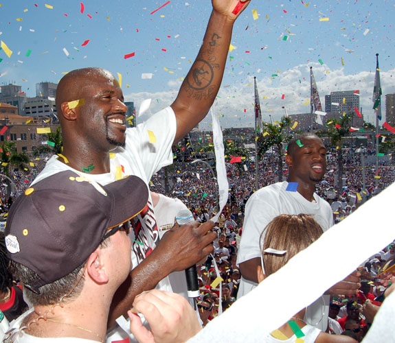 Miami Heat center Shaquille O'Neal acknowledges fans under a rain of confetti during the team's NBA Championship celebration at the Arena.