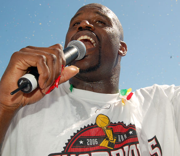 Miami Heat center Shaquille O'Neal shows off his rapping skills for fans during the team's NBA Championship Celebration in front of the AmericanAirlines Arena.