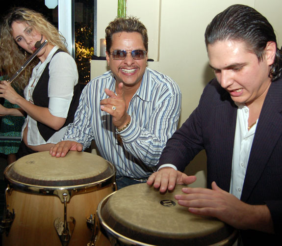 Latin music producer Tito Puente, Jr., plays his bongos for guests at the two-year anniversary party for popular Ivy Aventura in Loehmann's Plaza in Aventura.