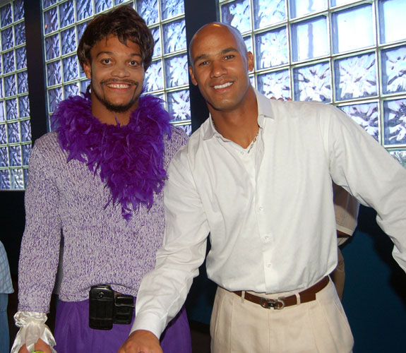 Miami Dolphins linebacker Channing Crowder, left, dressed in drag, with teammate Jason Taylor, at Randy McMichael's charity bowling event.