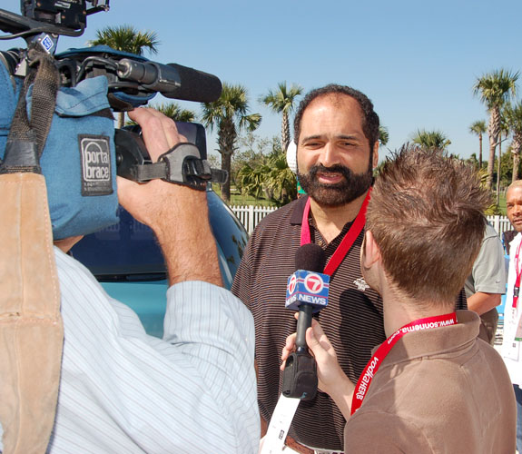 Ex-Pittsburgh Steelers running back Franco Harris speaks with a camera crew from WSVN prior to the start of Jim Brown's Super Bowl XLI Celebrity Golf Event.
